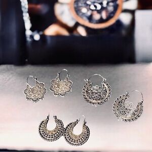 š antiqued silver crescent shaped Asian style dangle earring trio.